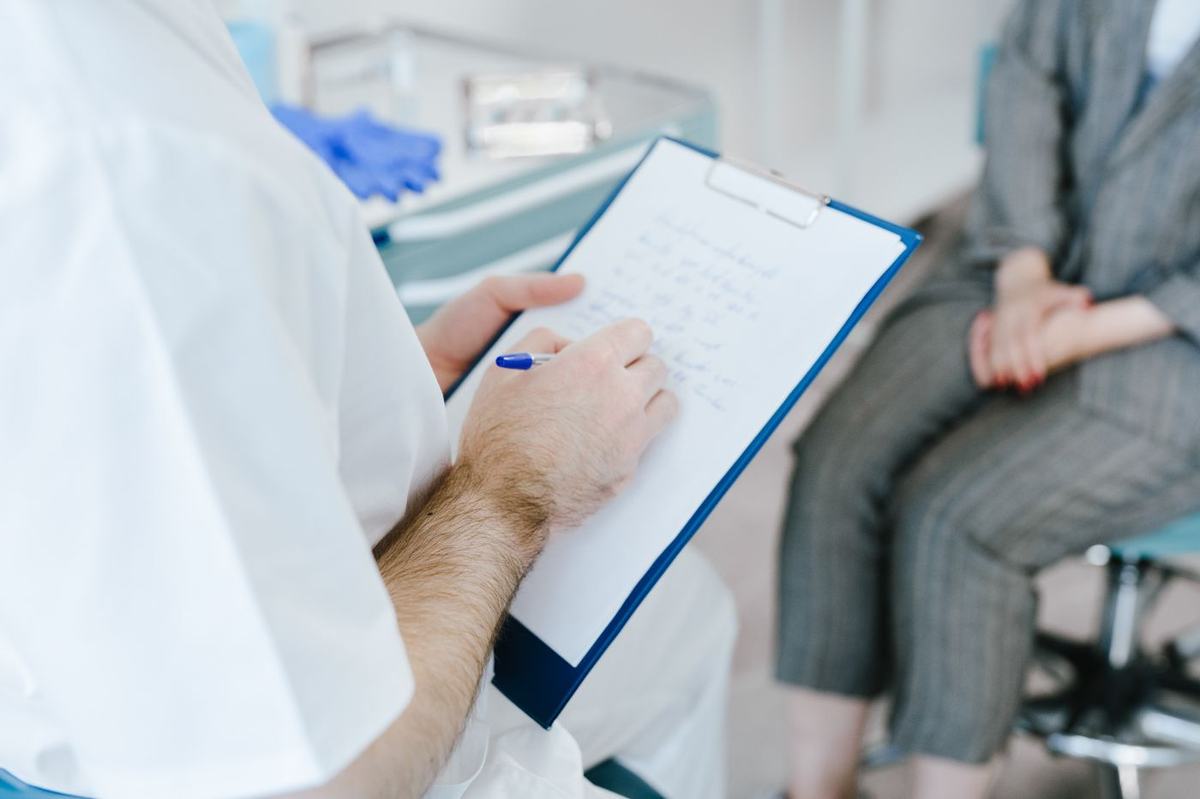 Dermatologist with a patient in consultation
